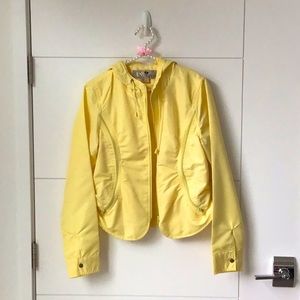 Yellow light jacket. Size large, but probably juniors sizing. Barely worn
